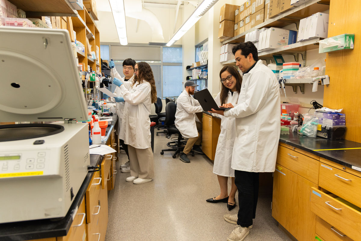 Jin (second from right) with lab members Boli Wu, Ellie Petty, Patrick Thompson and Ethan Badger (from left).