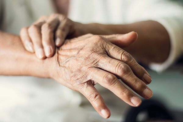 Person holding their wrist.