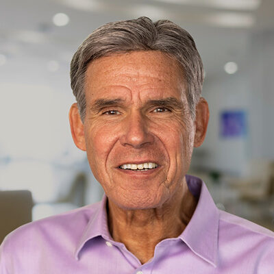 Professional headshot of Eric Topol, Scripps Research Translational Institute founder and director, in a light pink shirt.