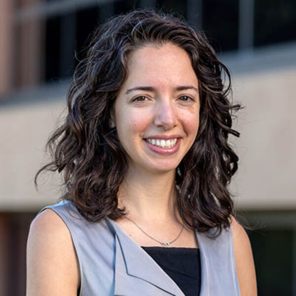 Professional headshot of Julia Moore Vogel, Scripps Research Translational Institute leader, outdoors in front of a building.