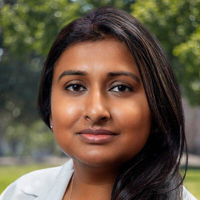Professional headshot of Dr. Stuti Jaiswal wearing a white lab coat.