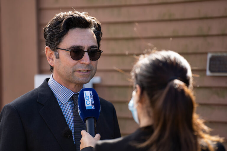 Scientist being interviewed by a reporter.