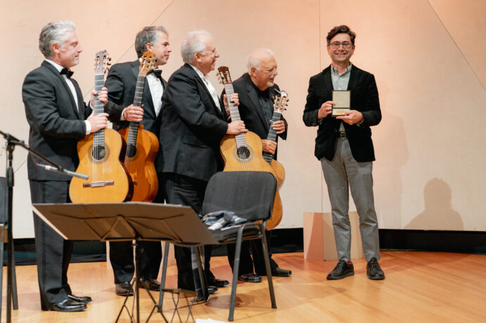 Ardem Patapoutian with The Romeros, famed Spanish guitar quartet, at his Nobel celebration