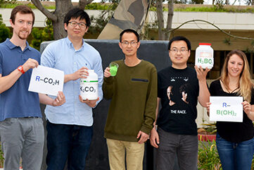 Co-authors of the study hold the ingredients to successfully carry out the new method. Left to right: David Peters, Ming Yan, Jie Wang, Chao Li and Lisa Barton. (Photo by Madeline McCurry-Schmidt.)