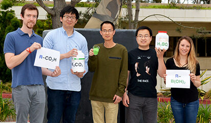 Co-authors of the study hold the ingredients to successfully carry out the new method. Left to right: David Peters, Ming Yan, Jie Wang, Chao Li and Lisa Barton. (Photo by Madeline McCurry-Schmidt.)