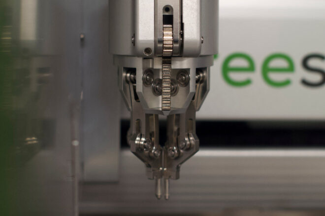 Vial-gripping arm of the Unchained Labs Big Kahuna, the node’s core piece of automation equipment